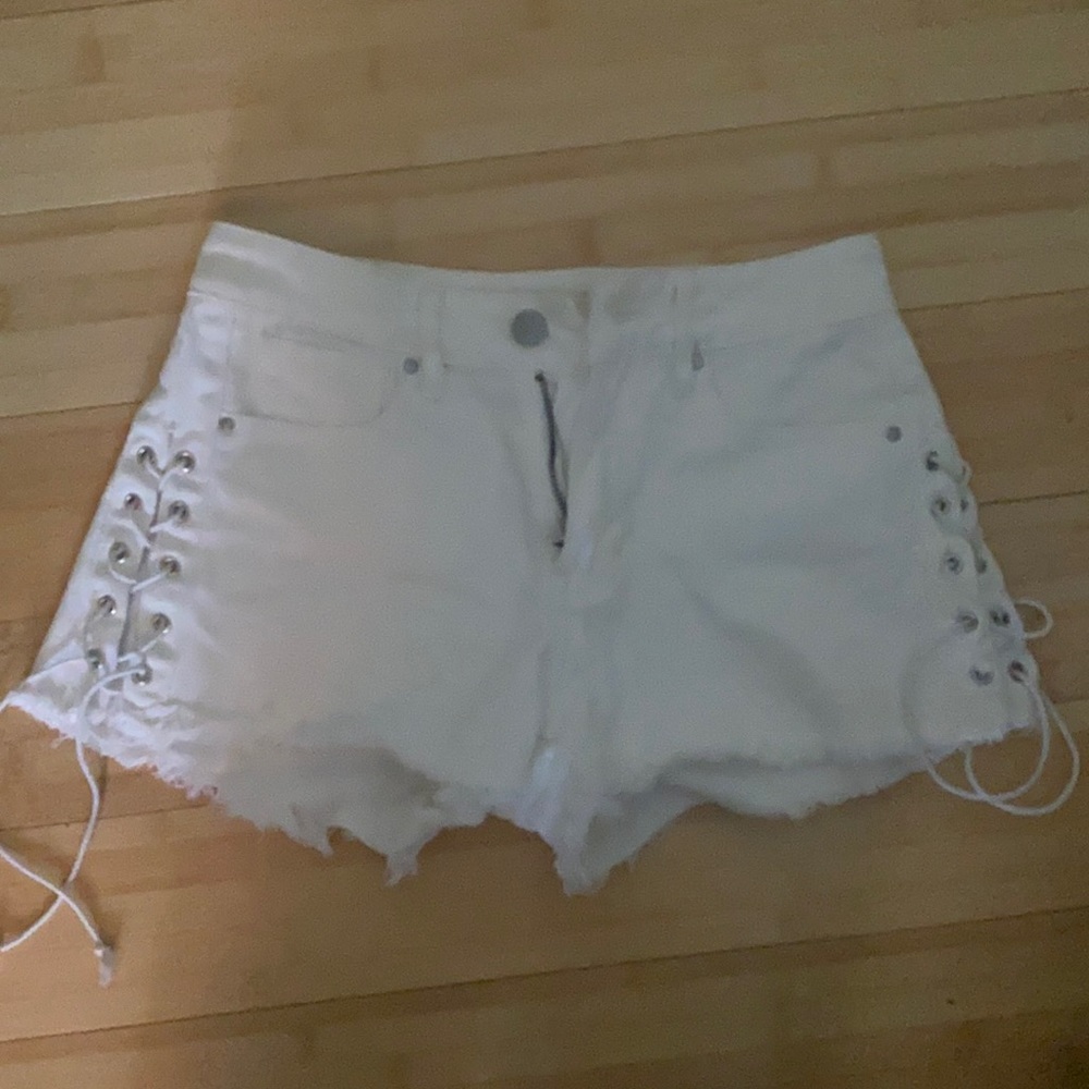 White jean shorts ties up the sides